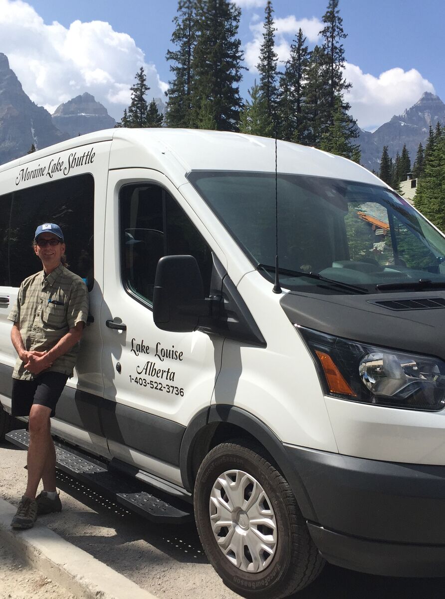 The Fairview Limo bus at the parking lot for the Valley of the Ten Peaks.